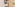 Happy blonde girl and father running through a bright bedroom doorway.