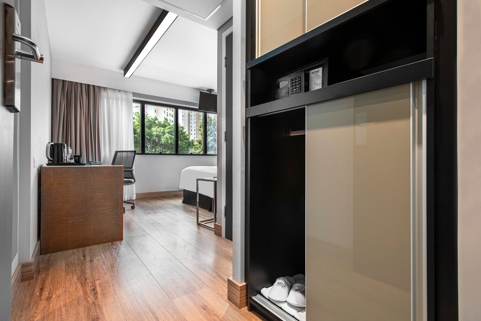 a room with a closet and a bed