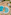 Aerial view of resort pools, kids' water park with slides, palm trees, and sun loungers.