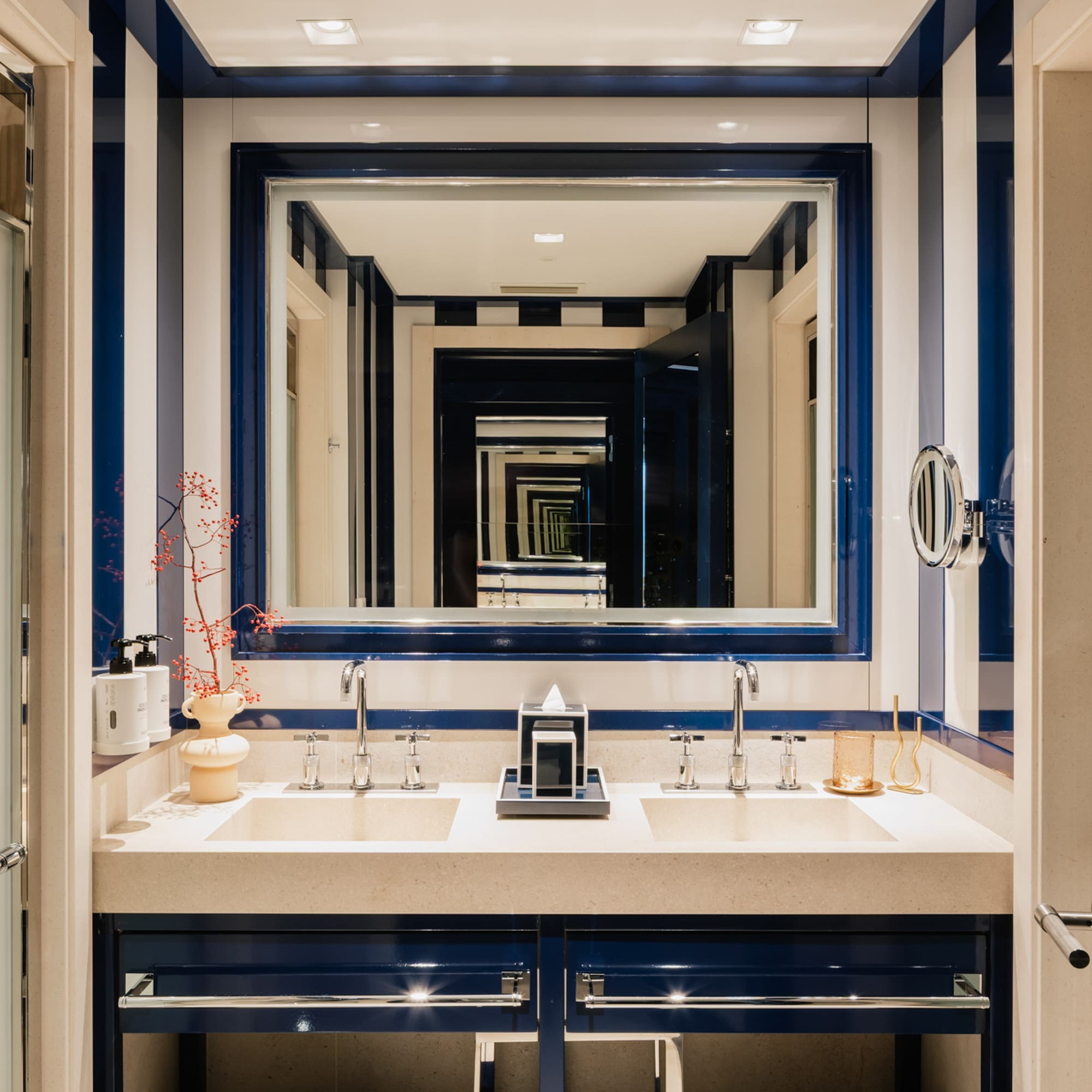 a bathroom with blue and white striped walls