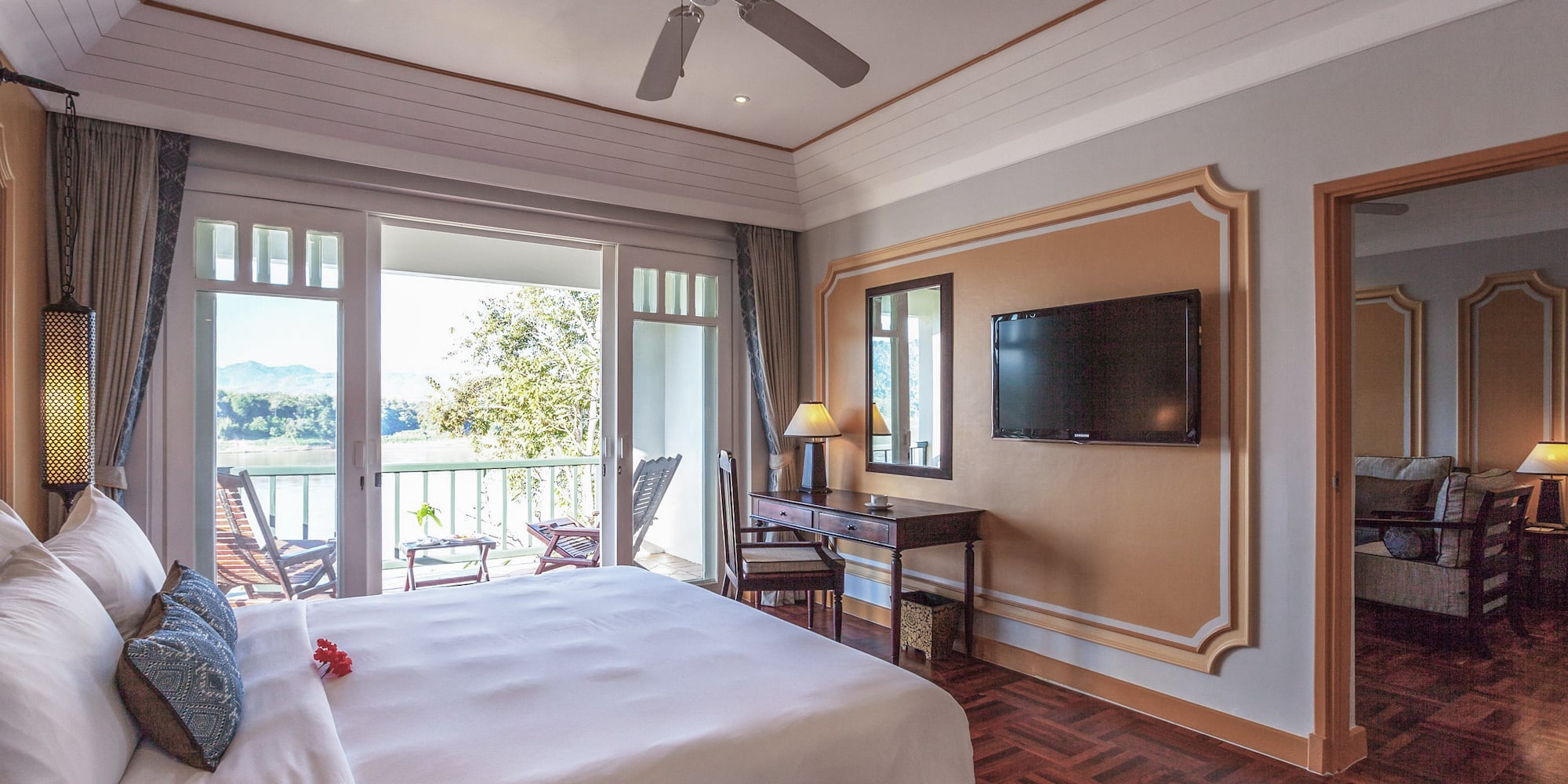 a bedroom with a television and a bed