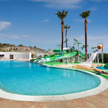 a pool with water slide and a water slide