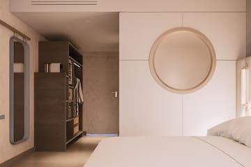 a room with a round mirror