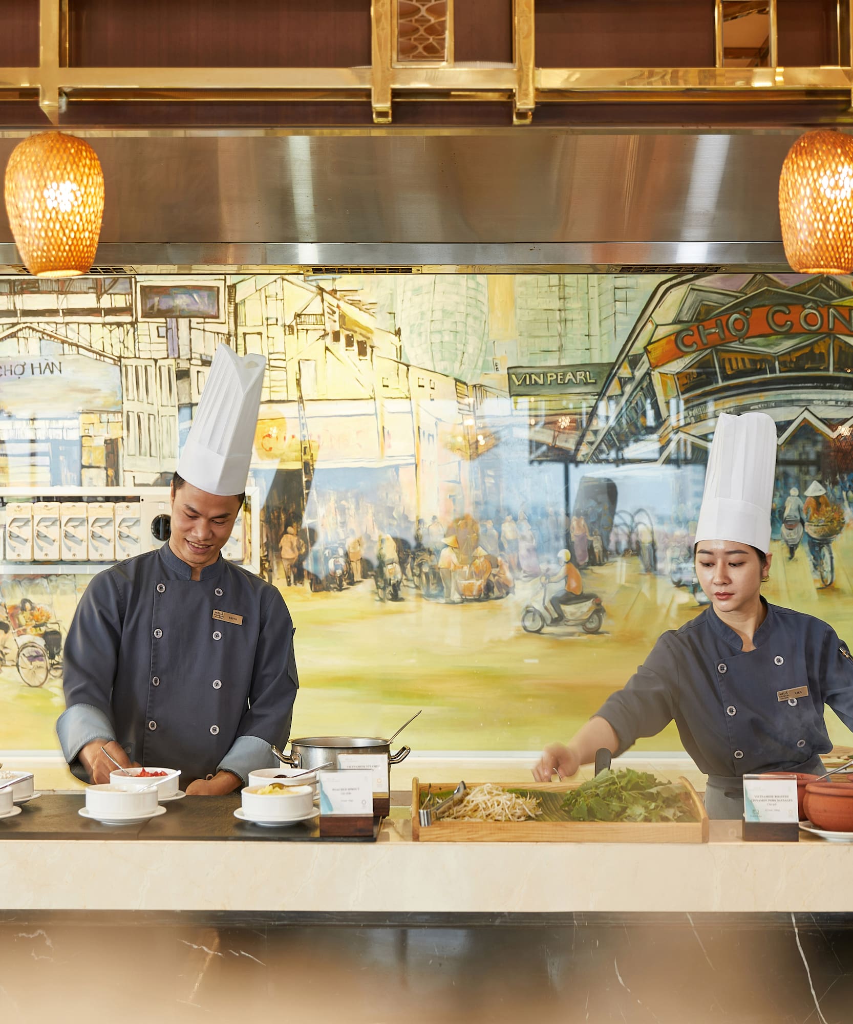 a man and woman cooking in a restaurant