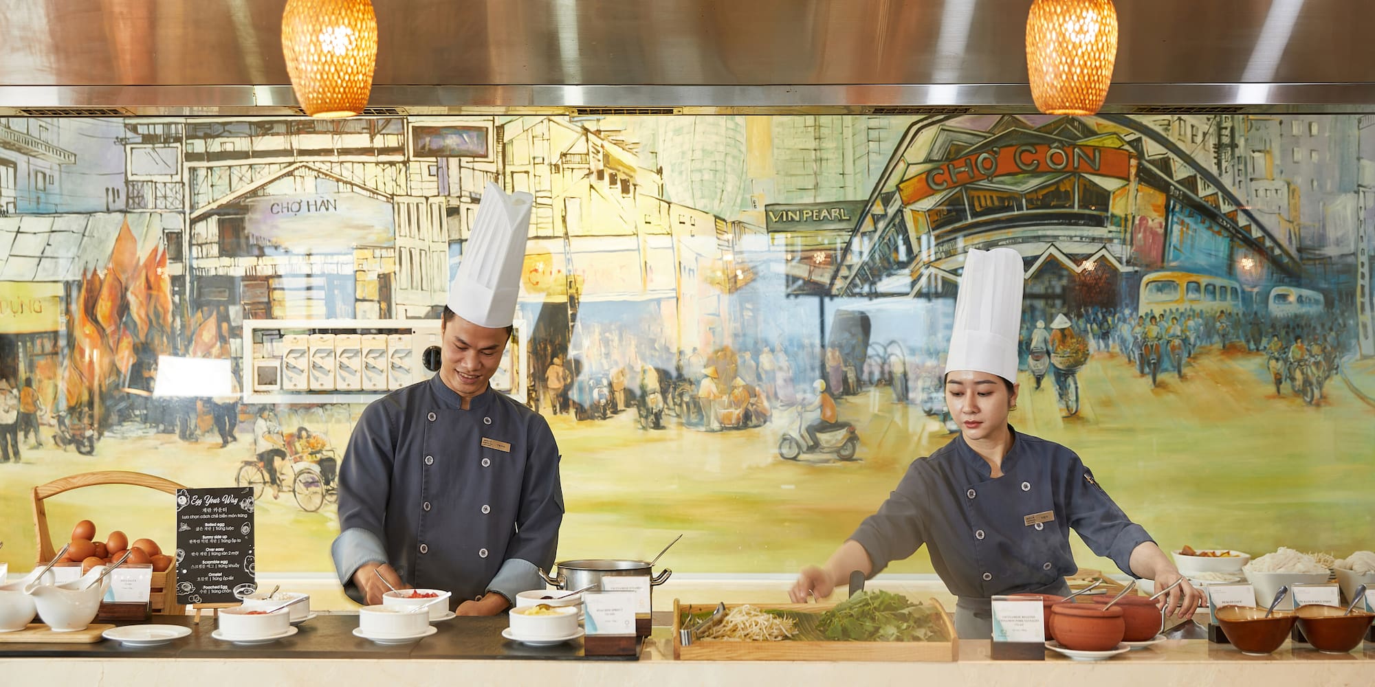 a man and woman cooking in a restaurant