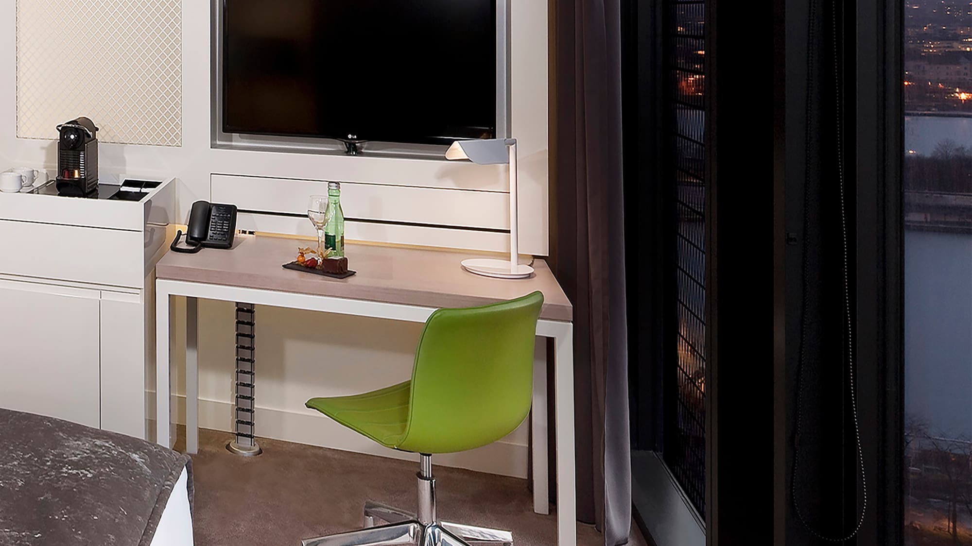 a room with a desk and a television