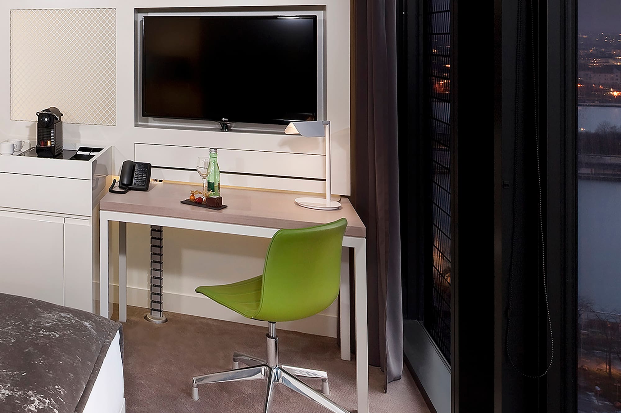 a room with a desk and a television