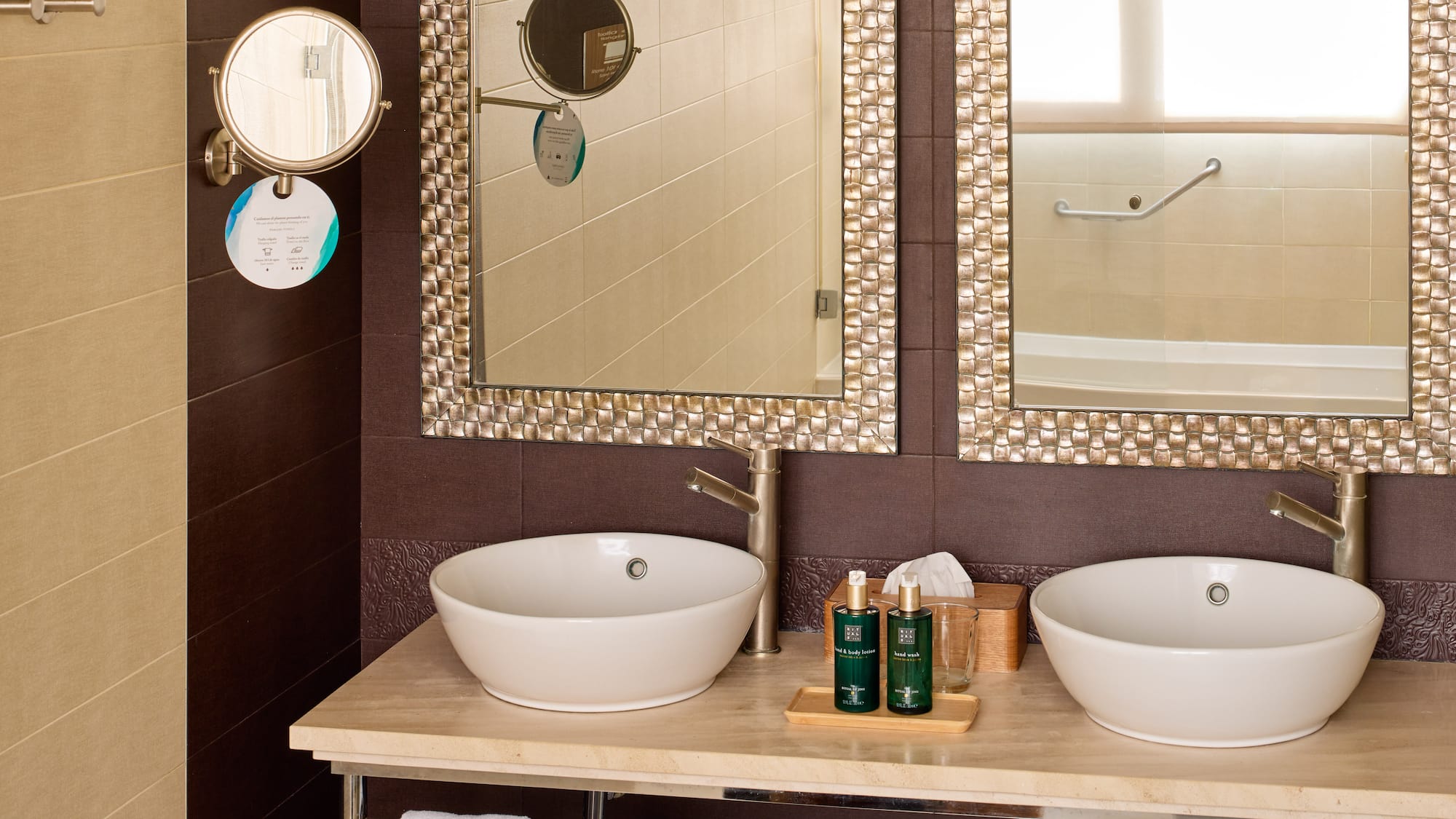 a bathroom with two sinks and mirrors
