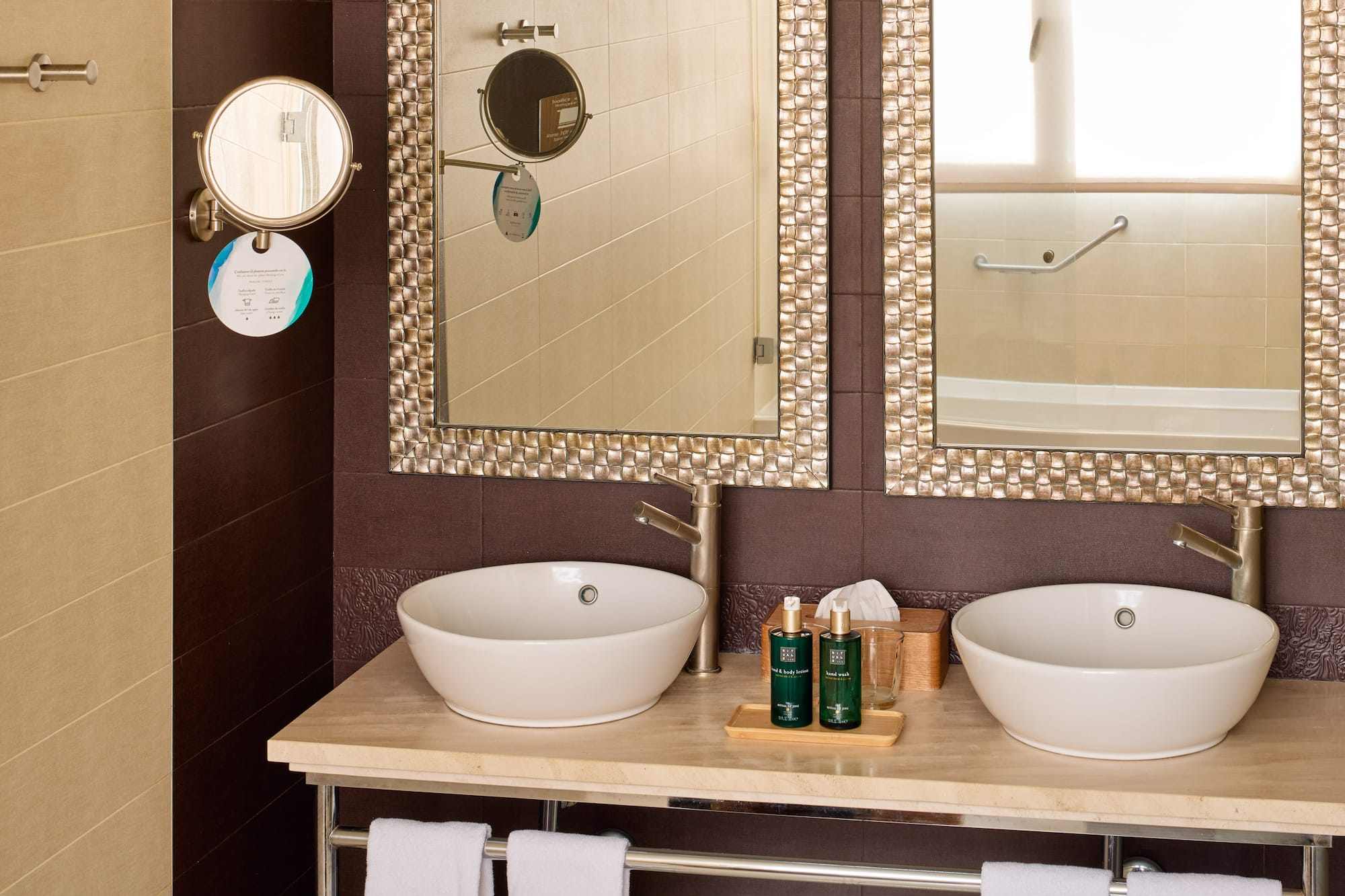 a bathroom with two sinks and mirrors