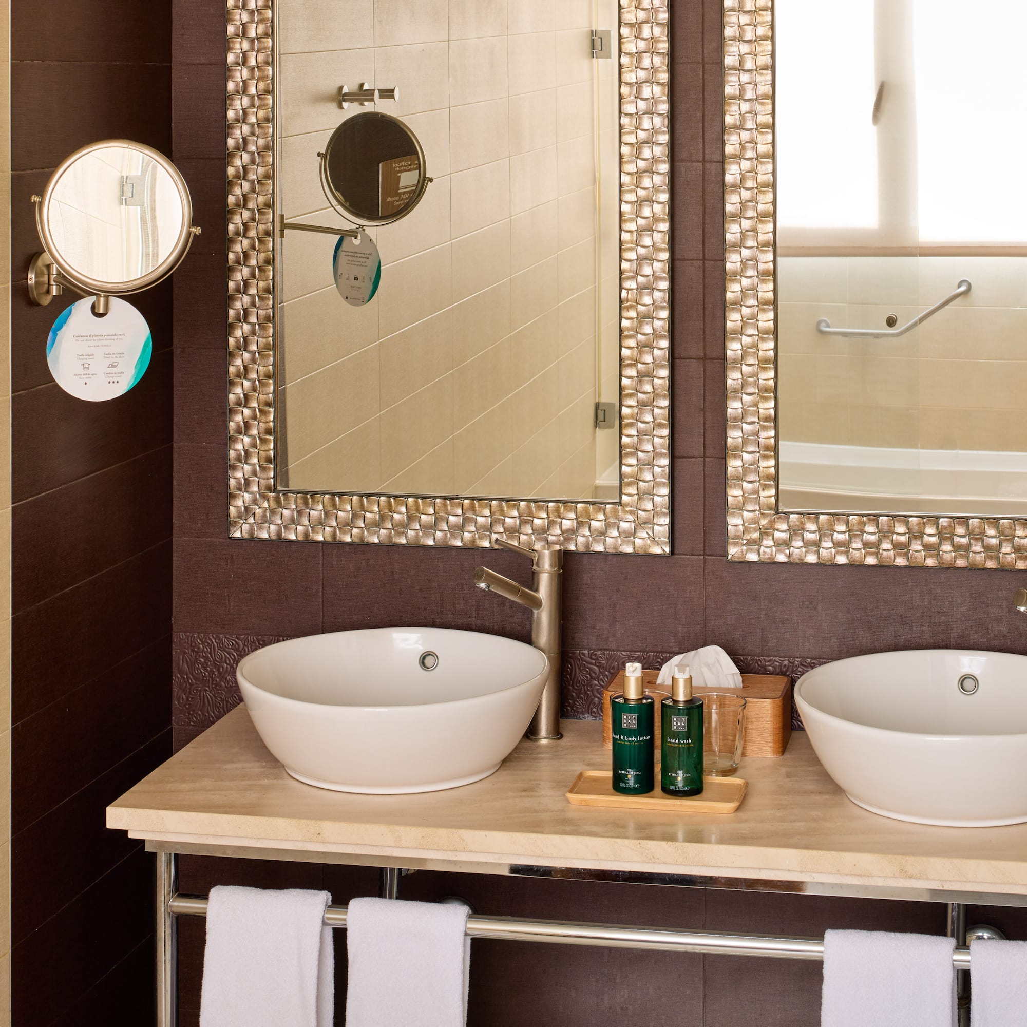 a bathroom with two sinks and mirrors