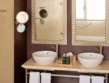 a bathroom with two sinks and mirrors
