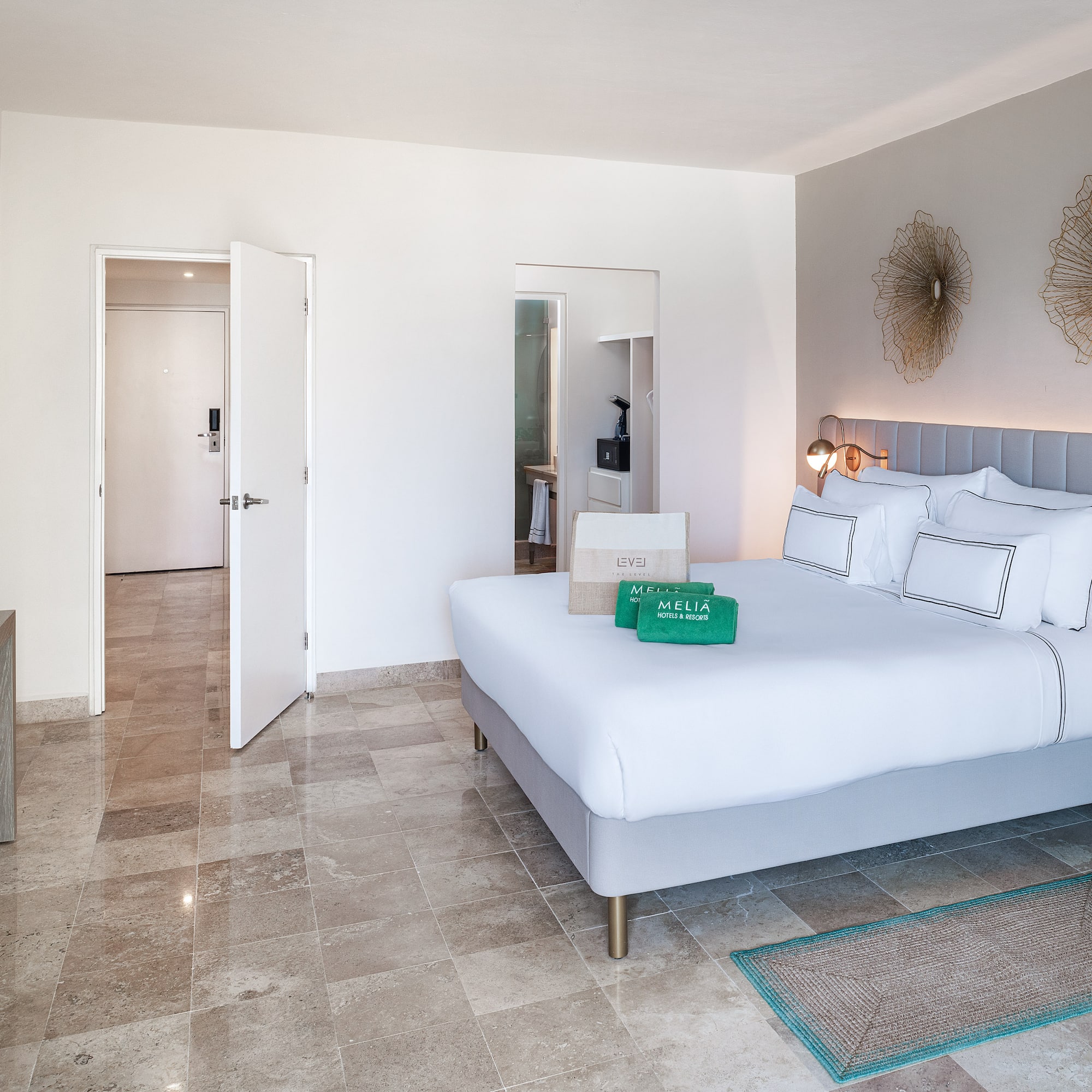 a bedroom with a bed and a mirror