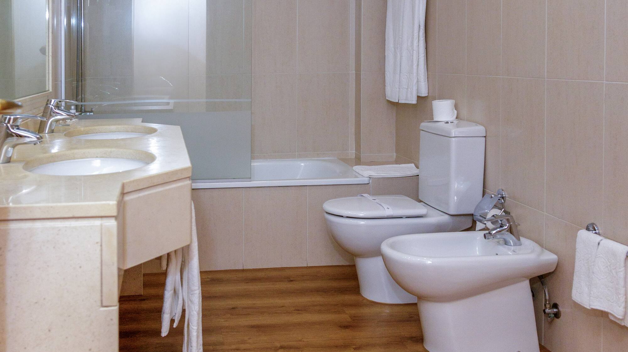 a bathroom with a shower and toilet