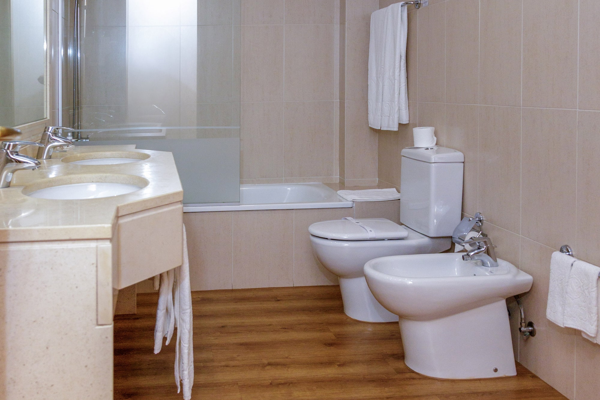 a bathroom with a shower and toilet
