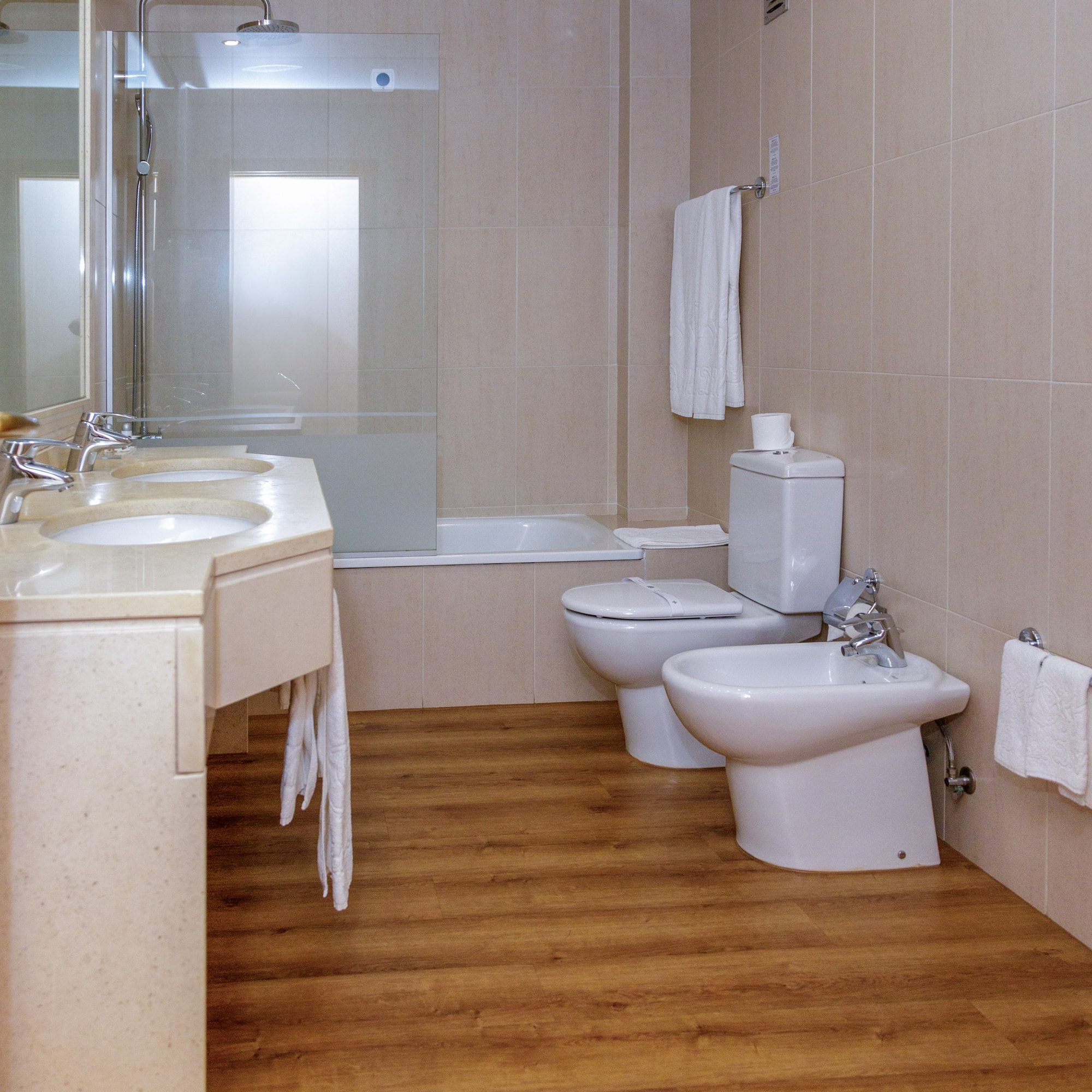 a bathroom with a shower and toilet