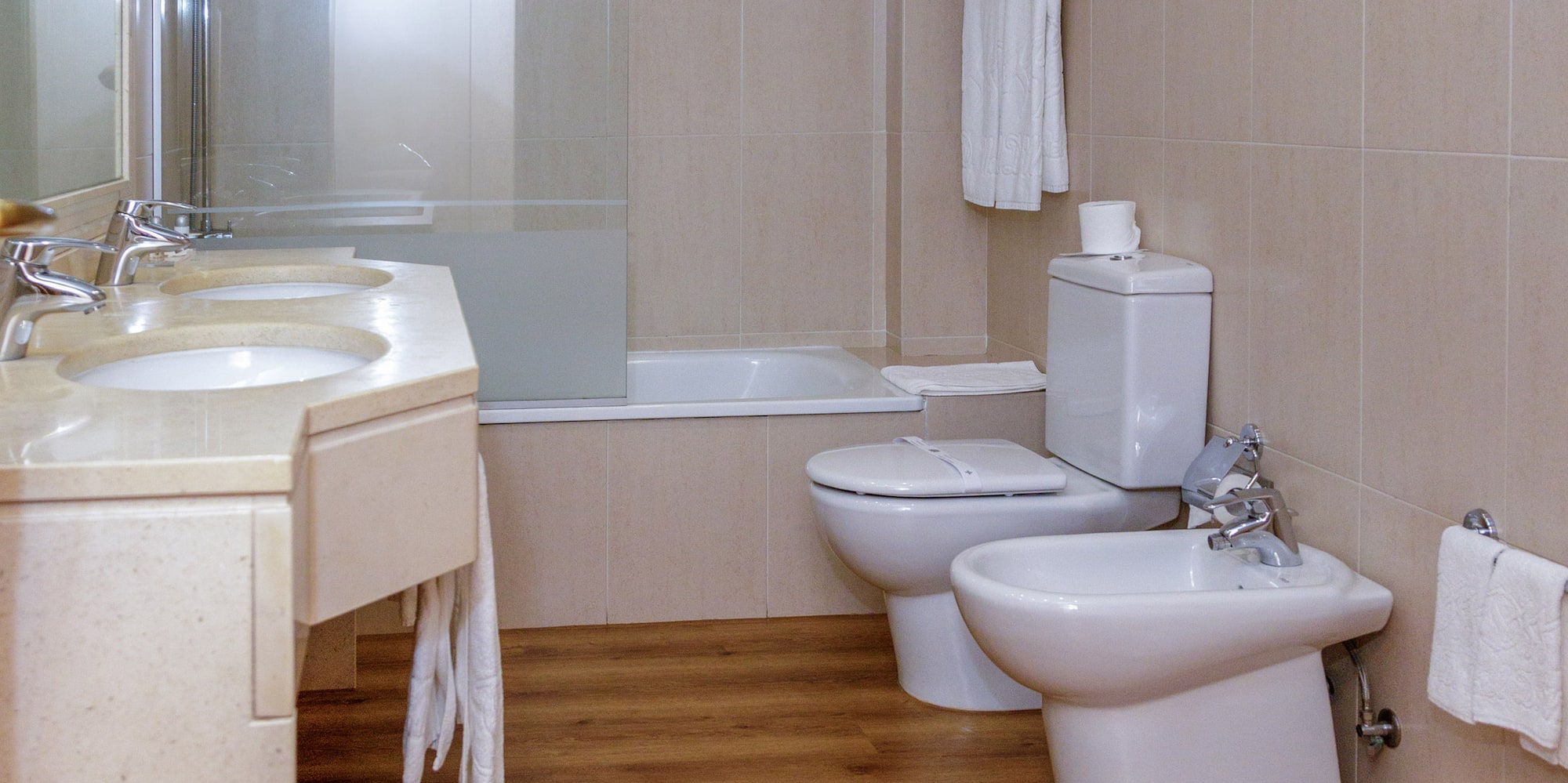 a bathroom with a shower and toilet