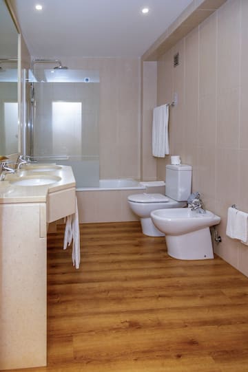 a bathroom with a shower and toilet