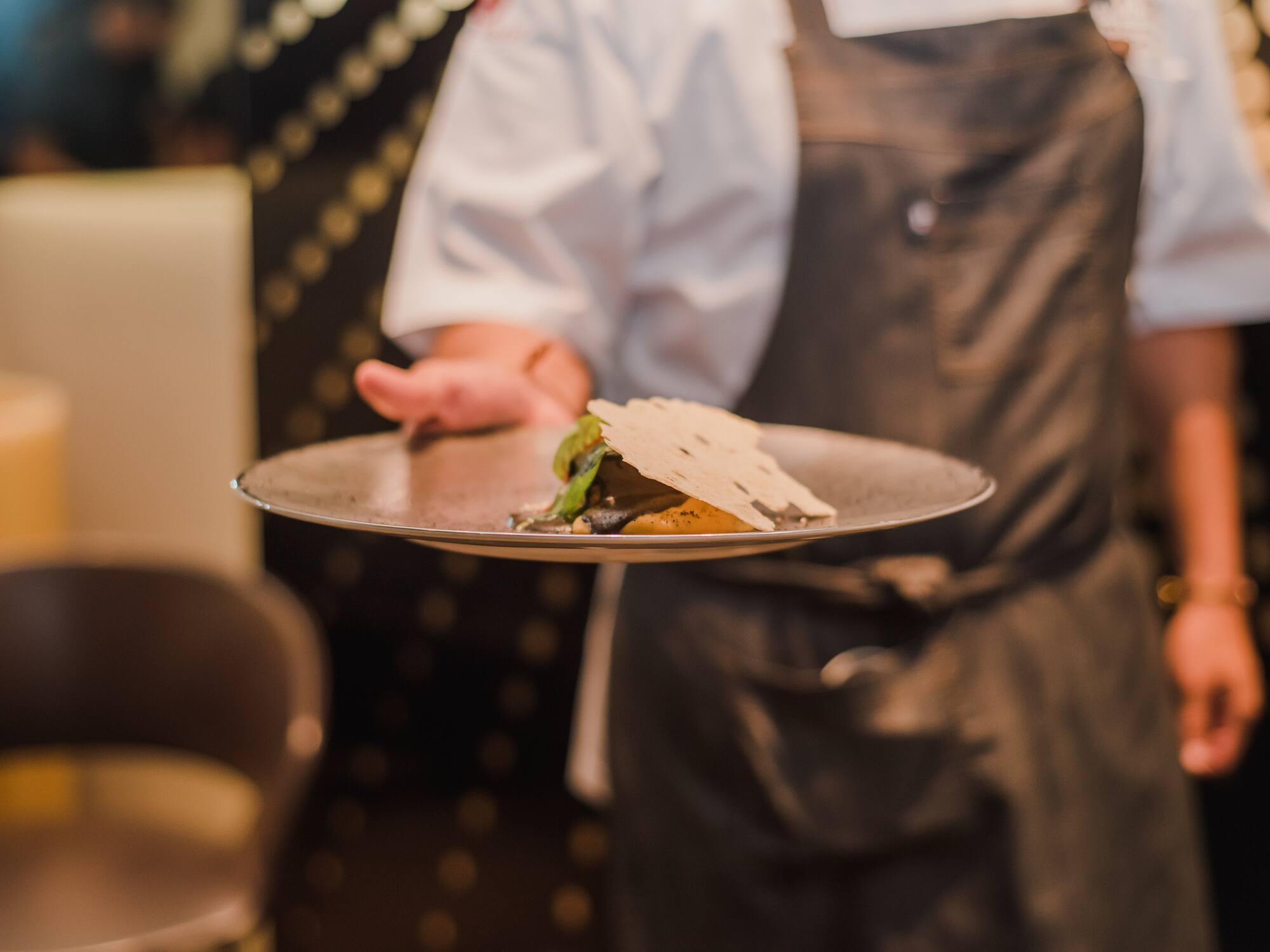 a person holding a plate of food