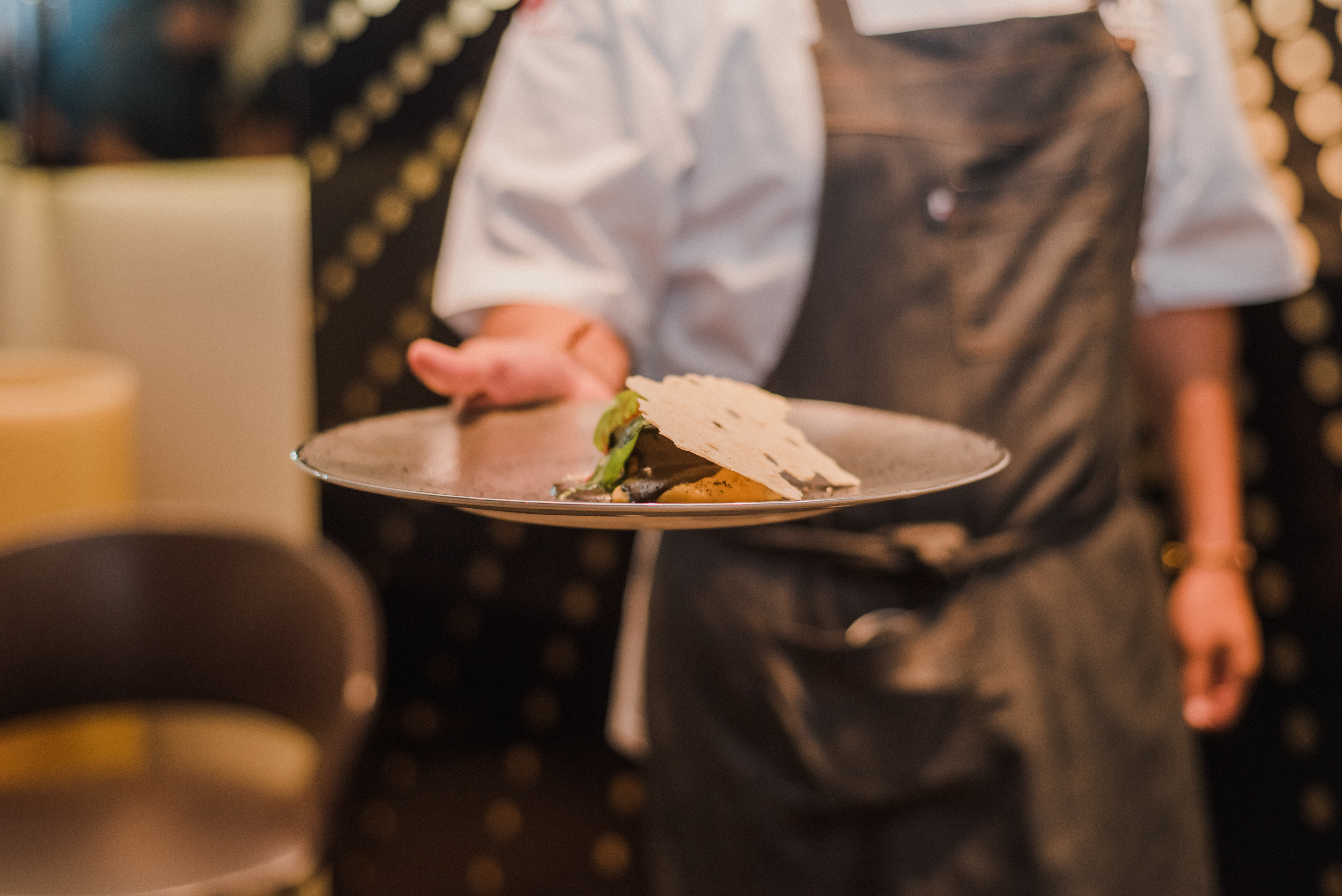 a person holding a plate of food