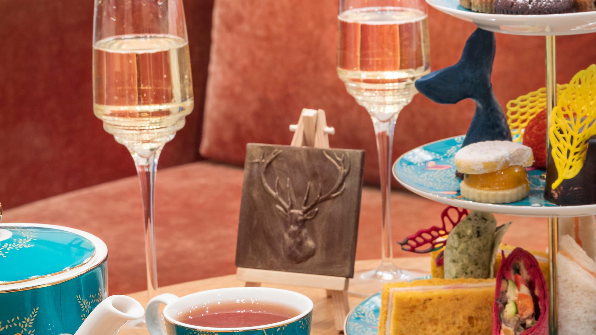 a tea set with tea cups and teapots