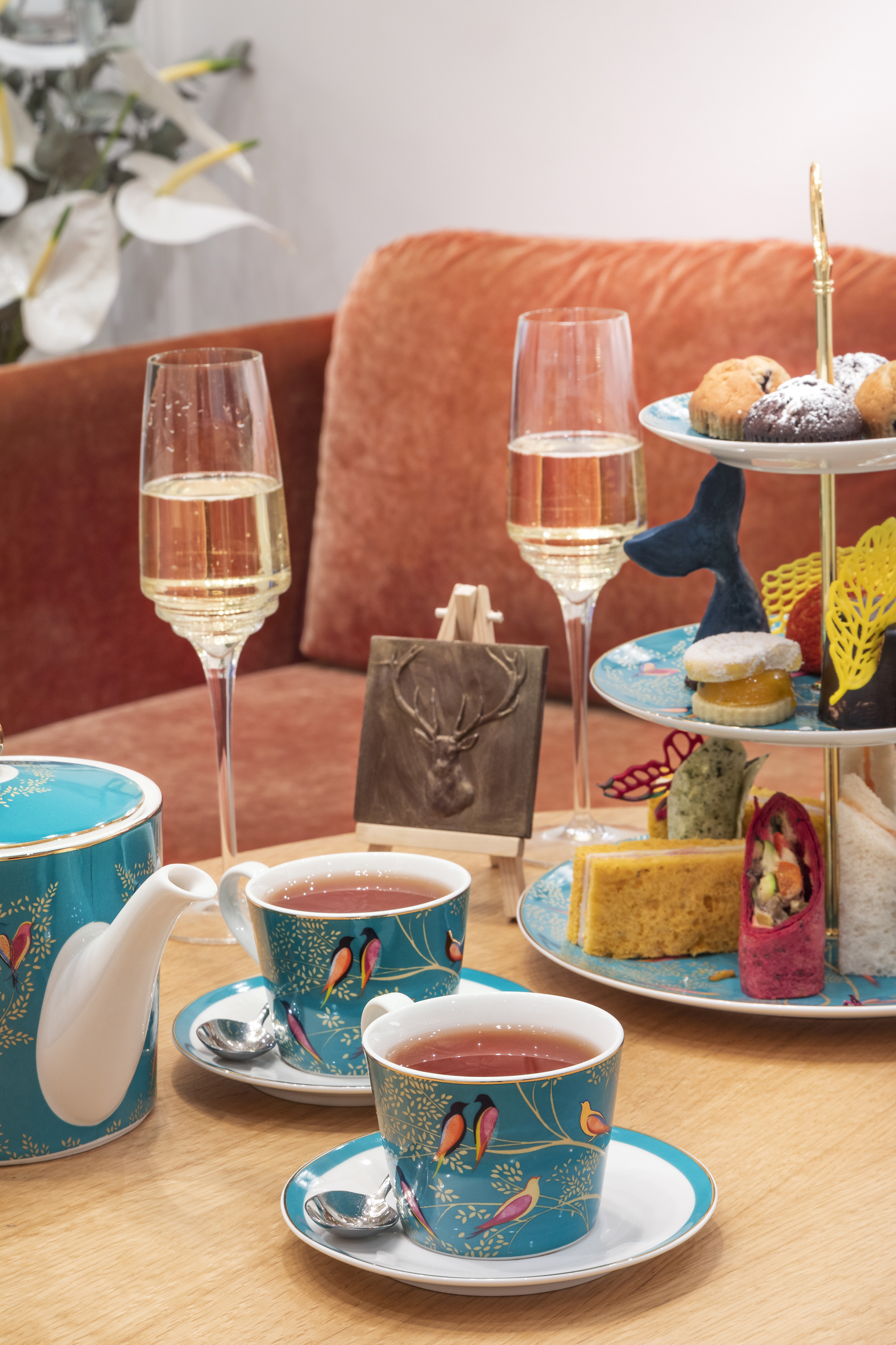 a tea set with tea cups and teapots