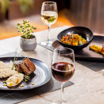 a plate of food and wine on a table