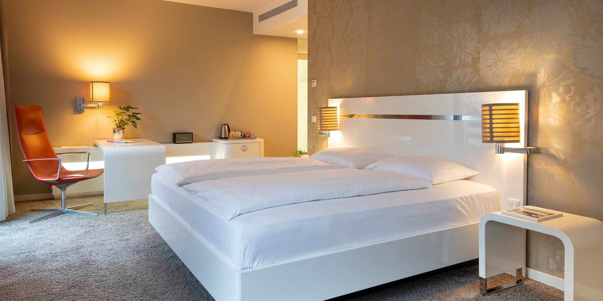 a bedroom with a bed and a desk