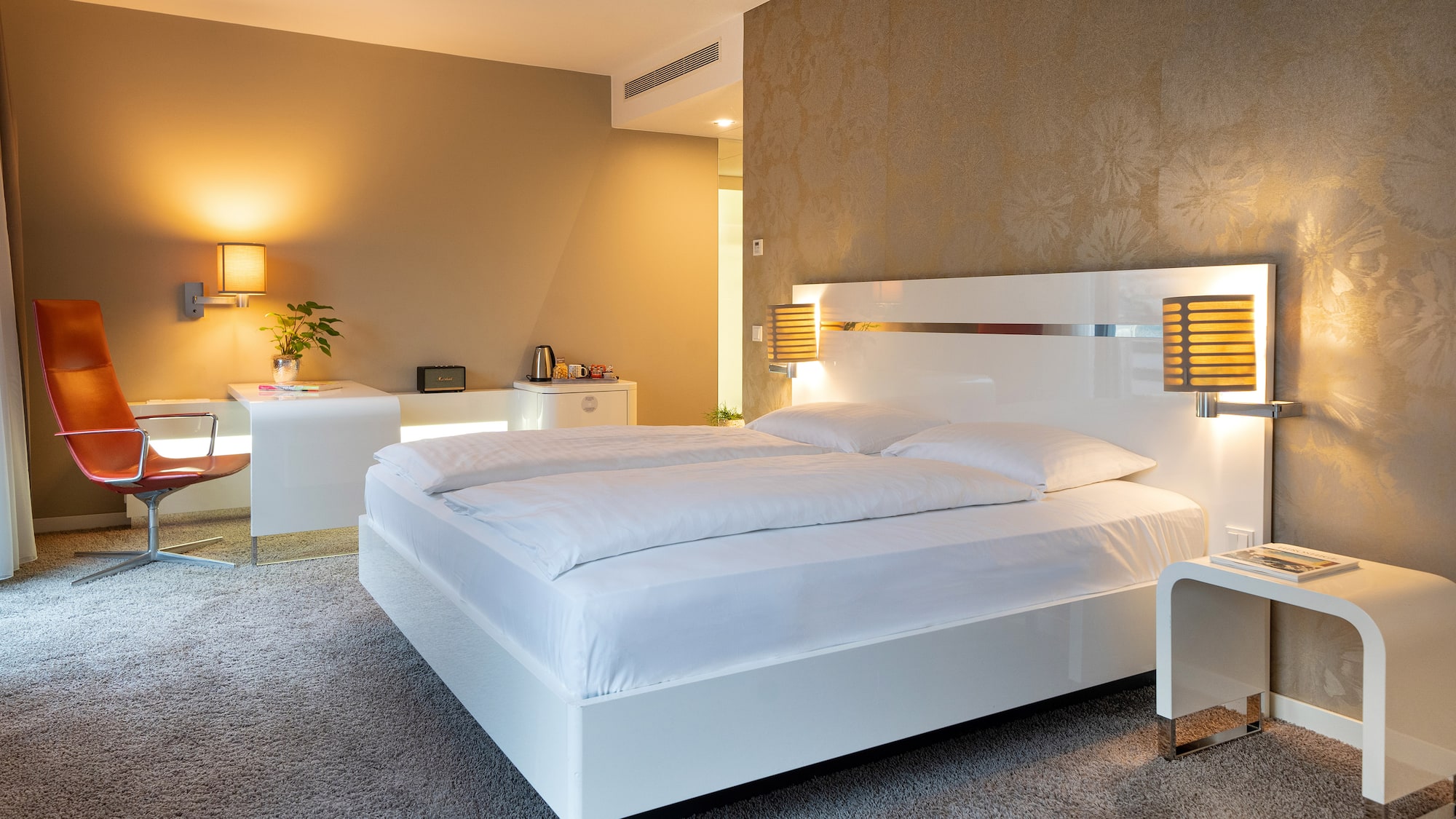 a bedroom with a bed and a desk