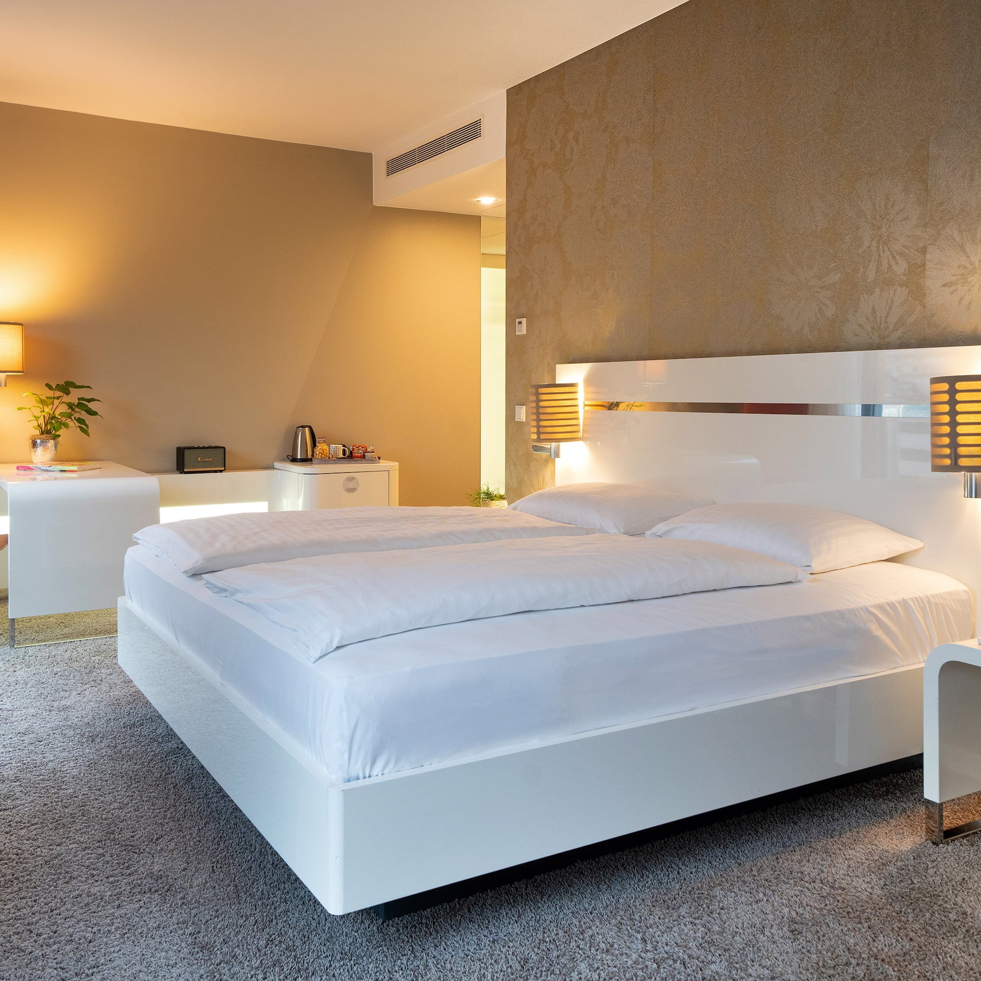 a bedroom with a bed and a desk