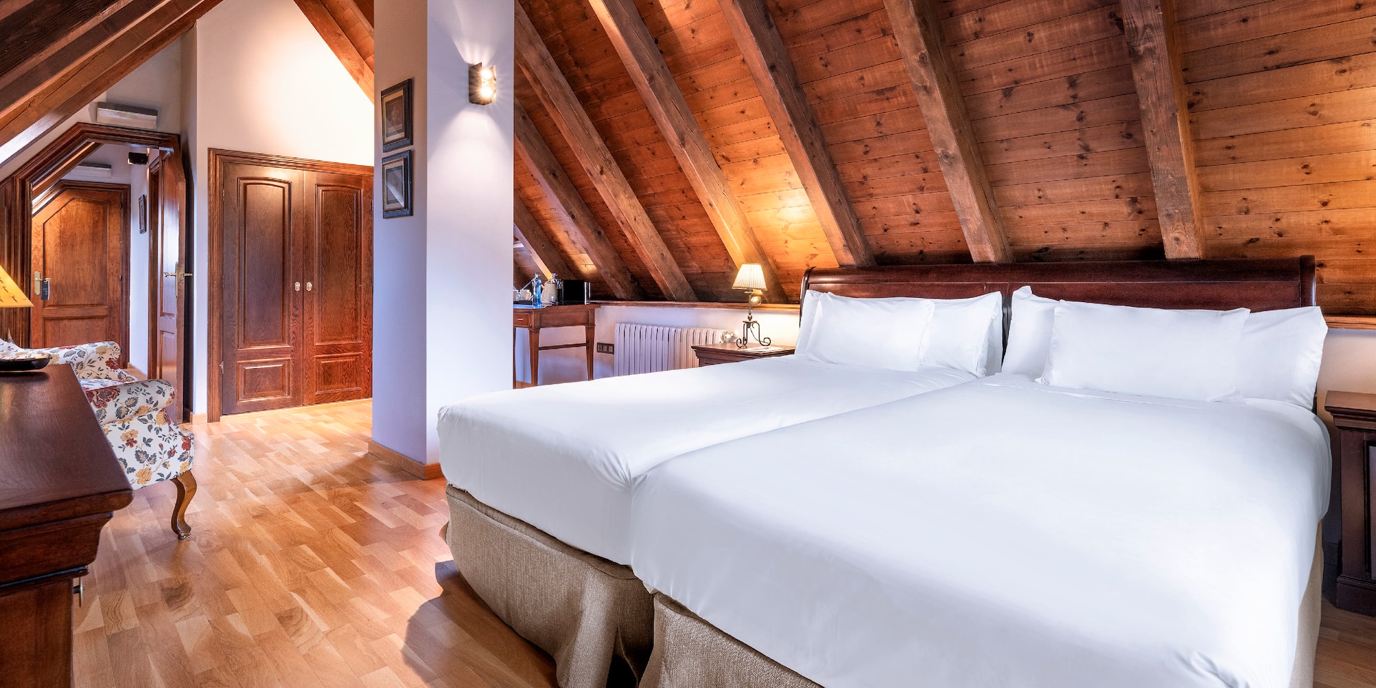 a bedroom with a wood ceiling and a wood floor