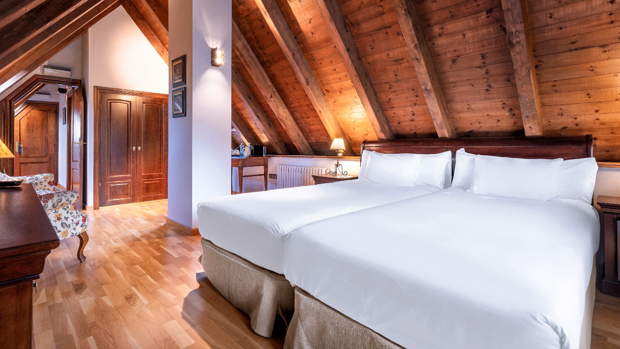 a bedroom with a wood ceiling and a wood floor