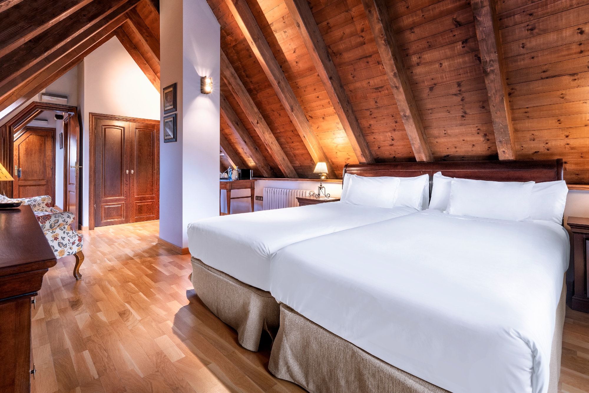 a bedroom with a wood ceiling and a wood floor