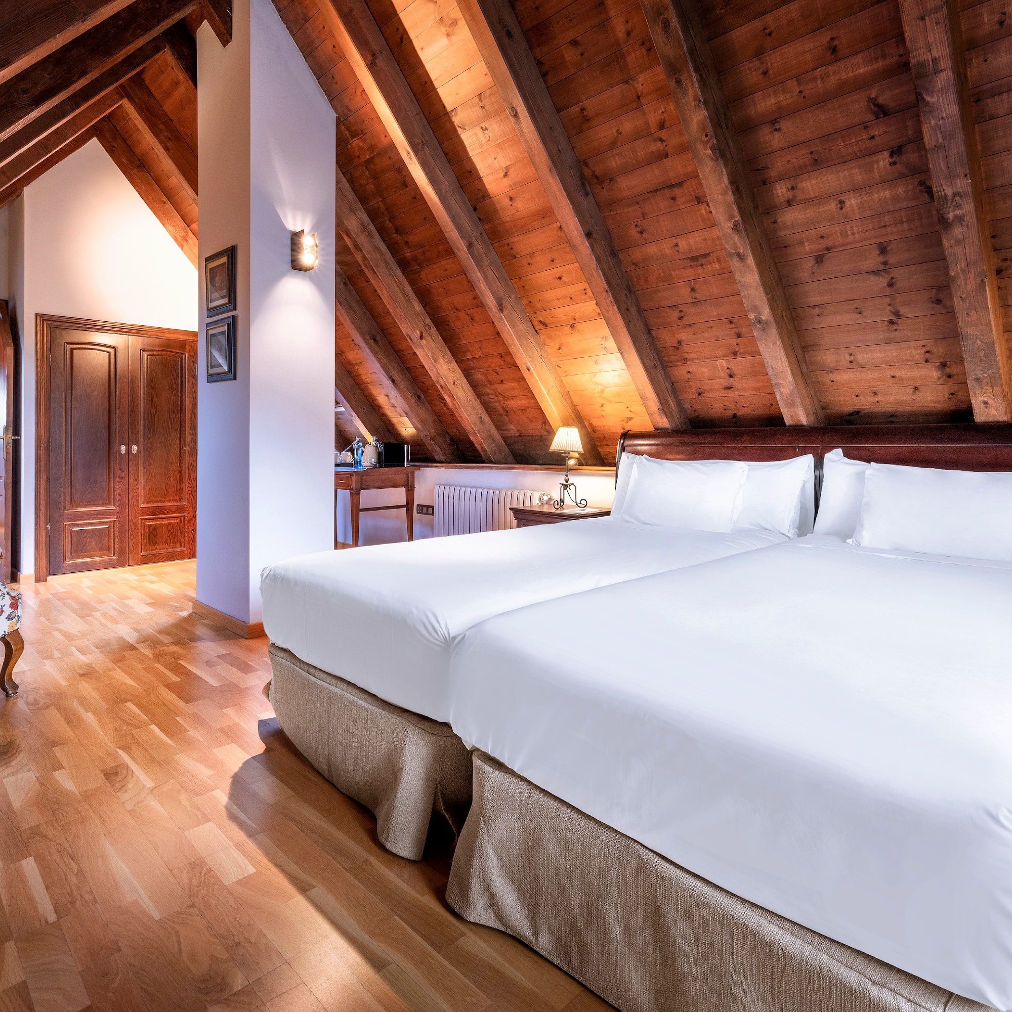 a bedroom with a wood ceiling and a wood floor
