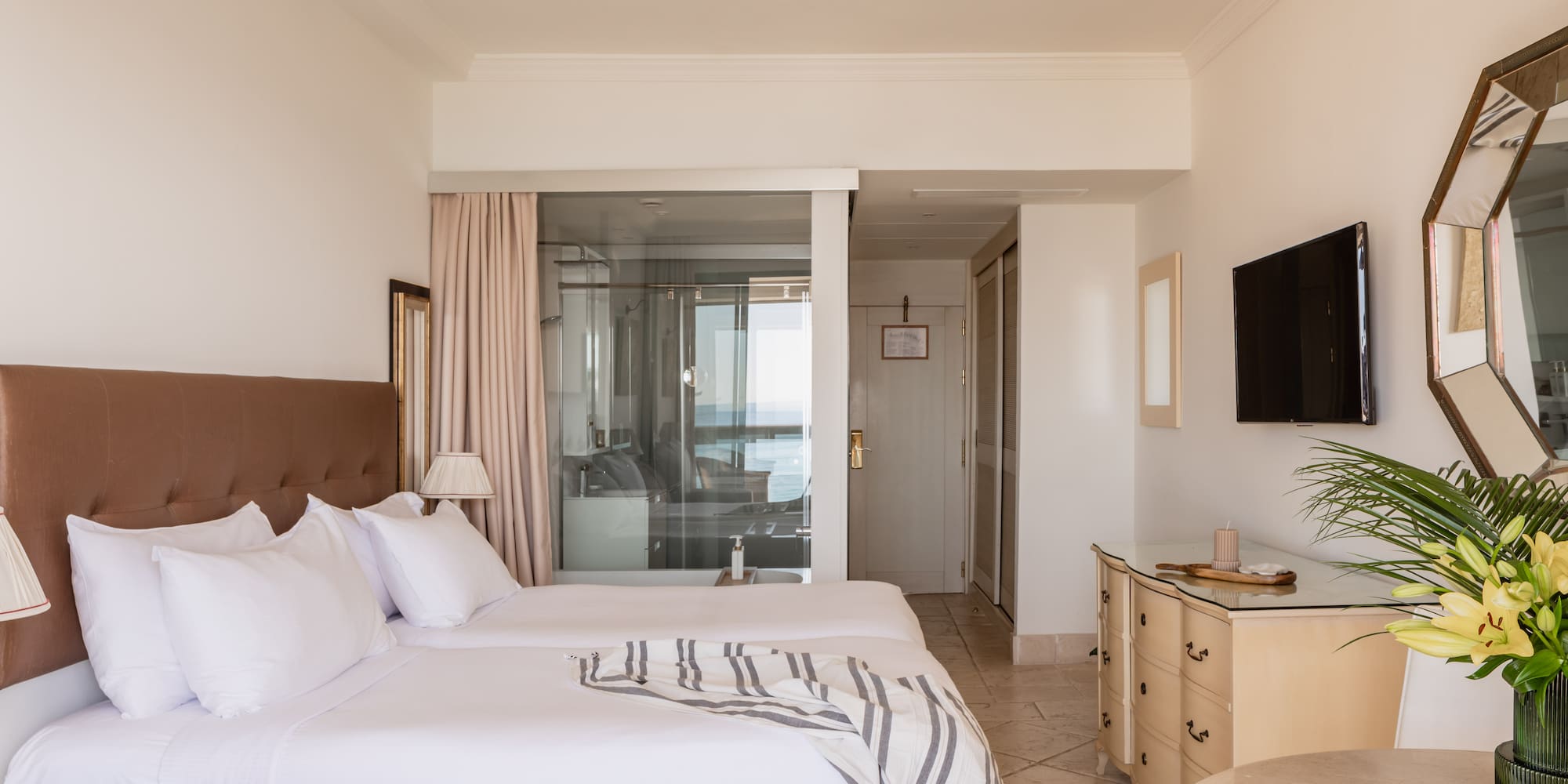 a bedroom with a television and a bed