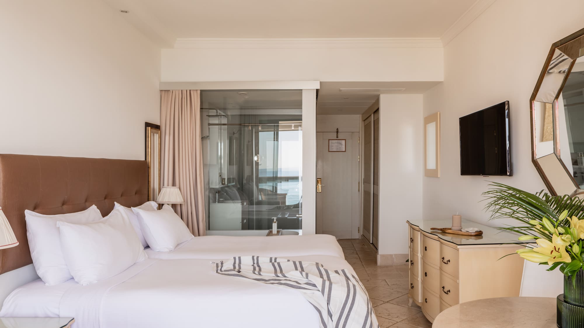 a bedroom with a television and a bed