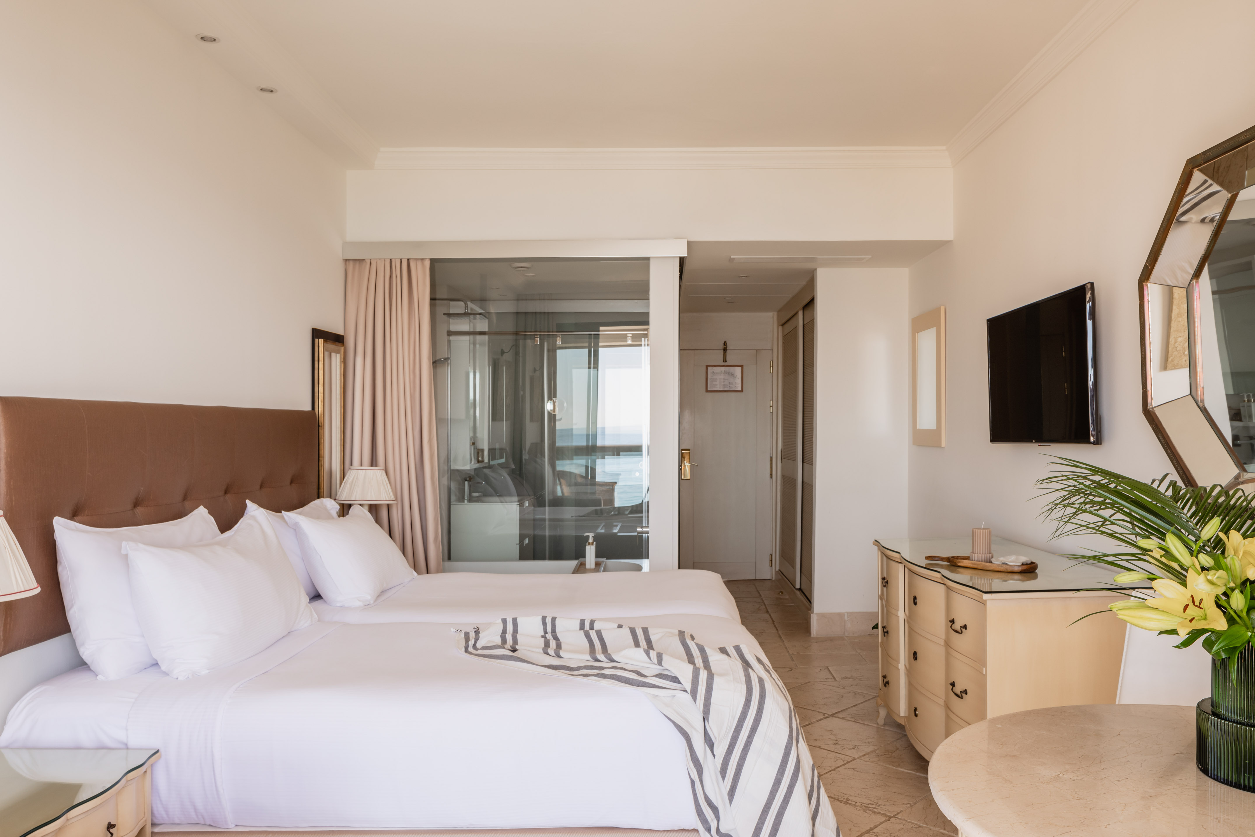 a bedroom with a television and a bed