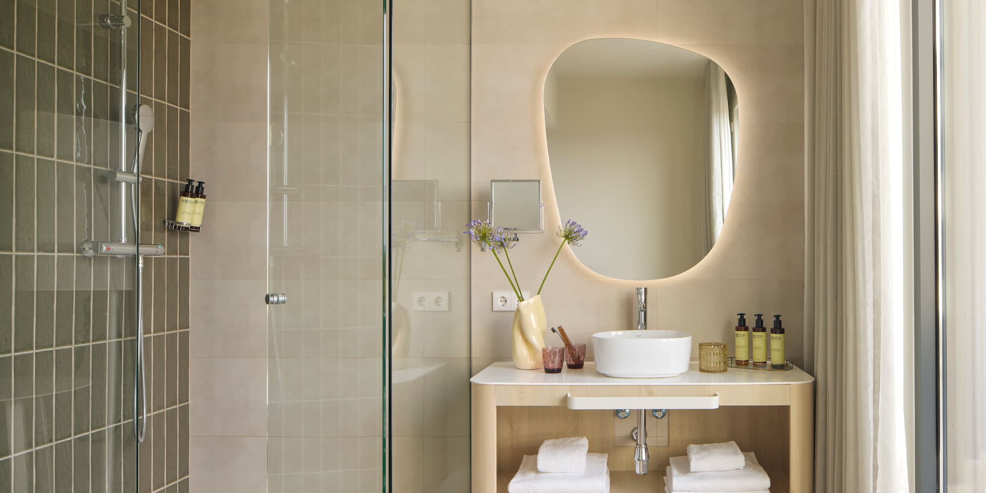 a bathroom with a mirror and a sink