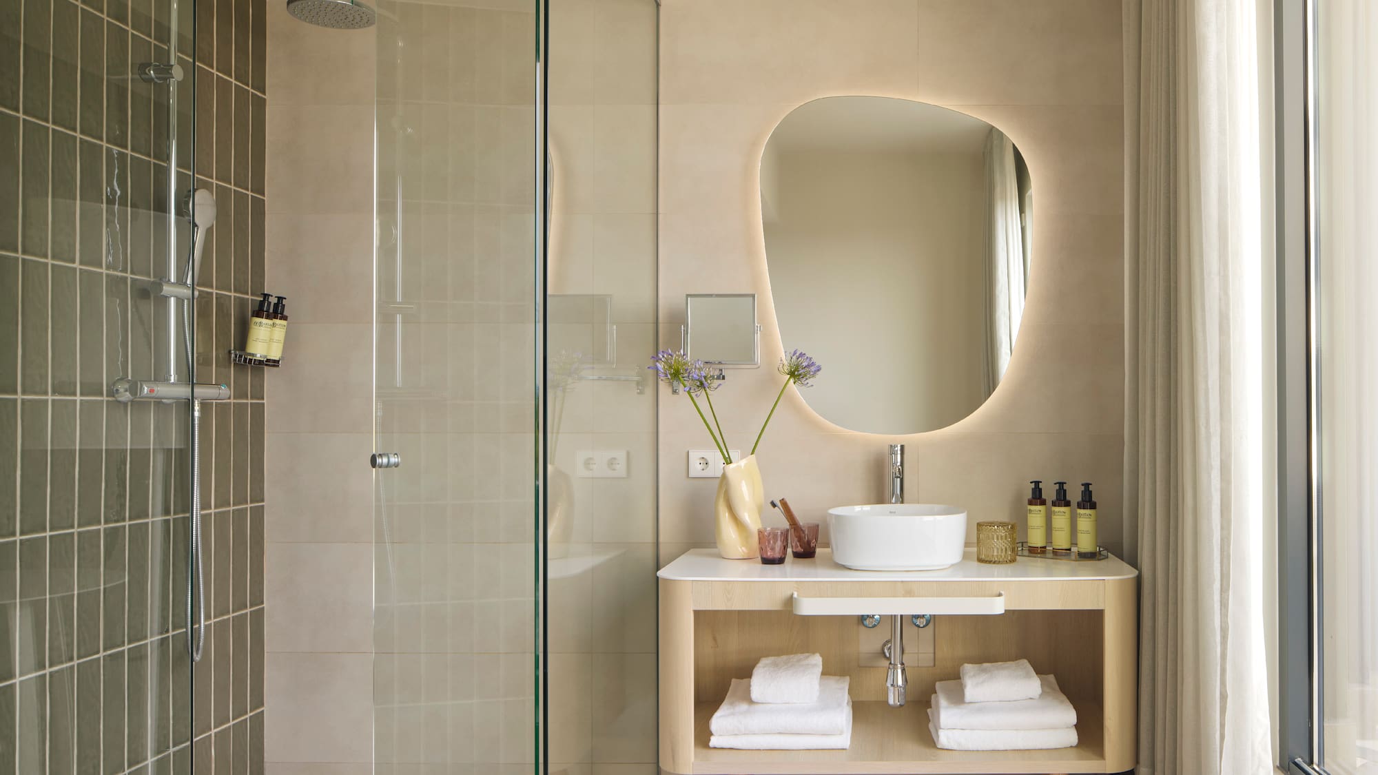 a bathroom with a mirror and a sink
