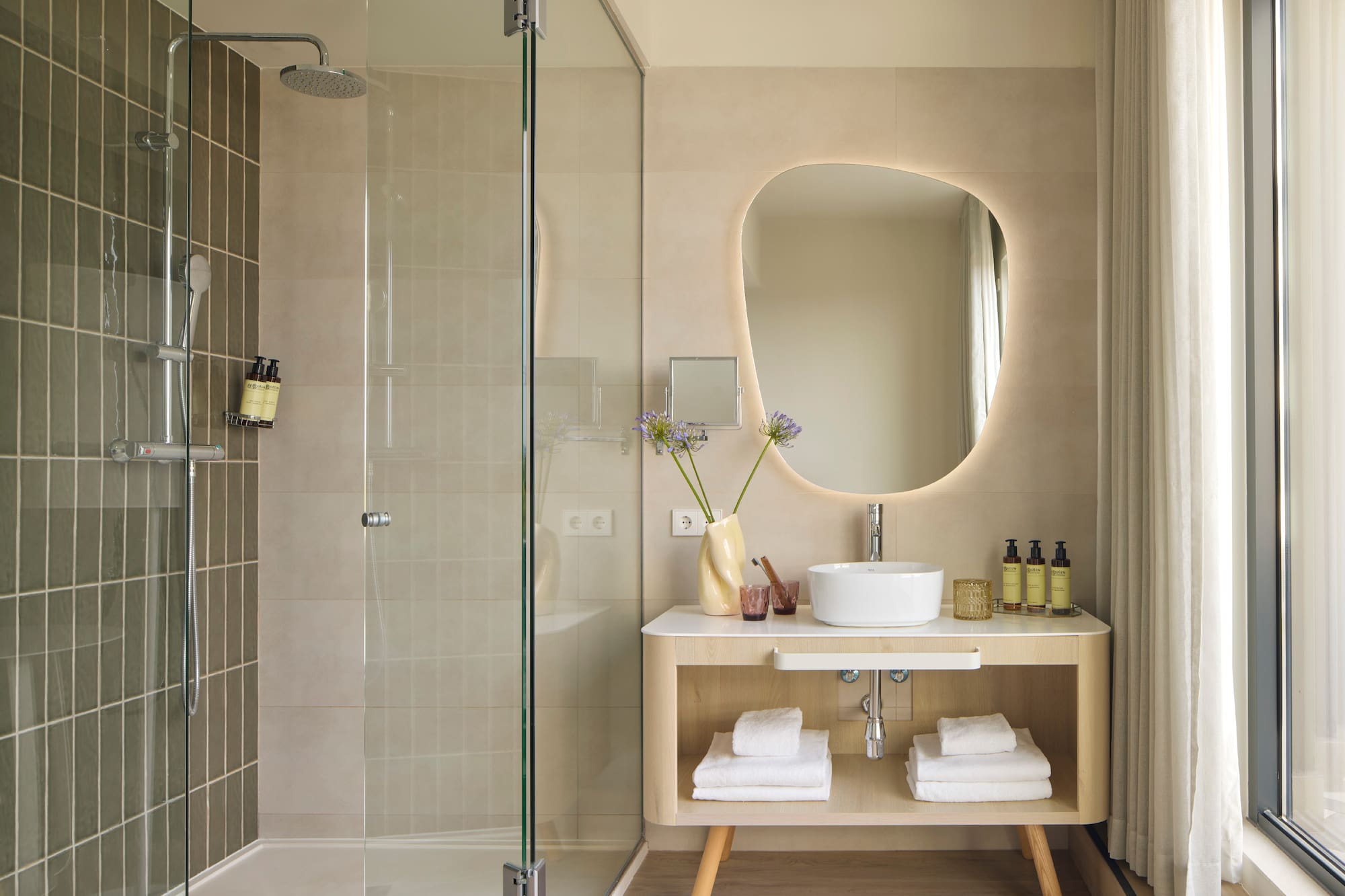 a bathroom with a mirror and a sink