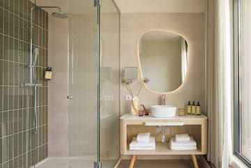 a bathroom with a mirror and a sink