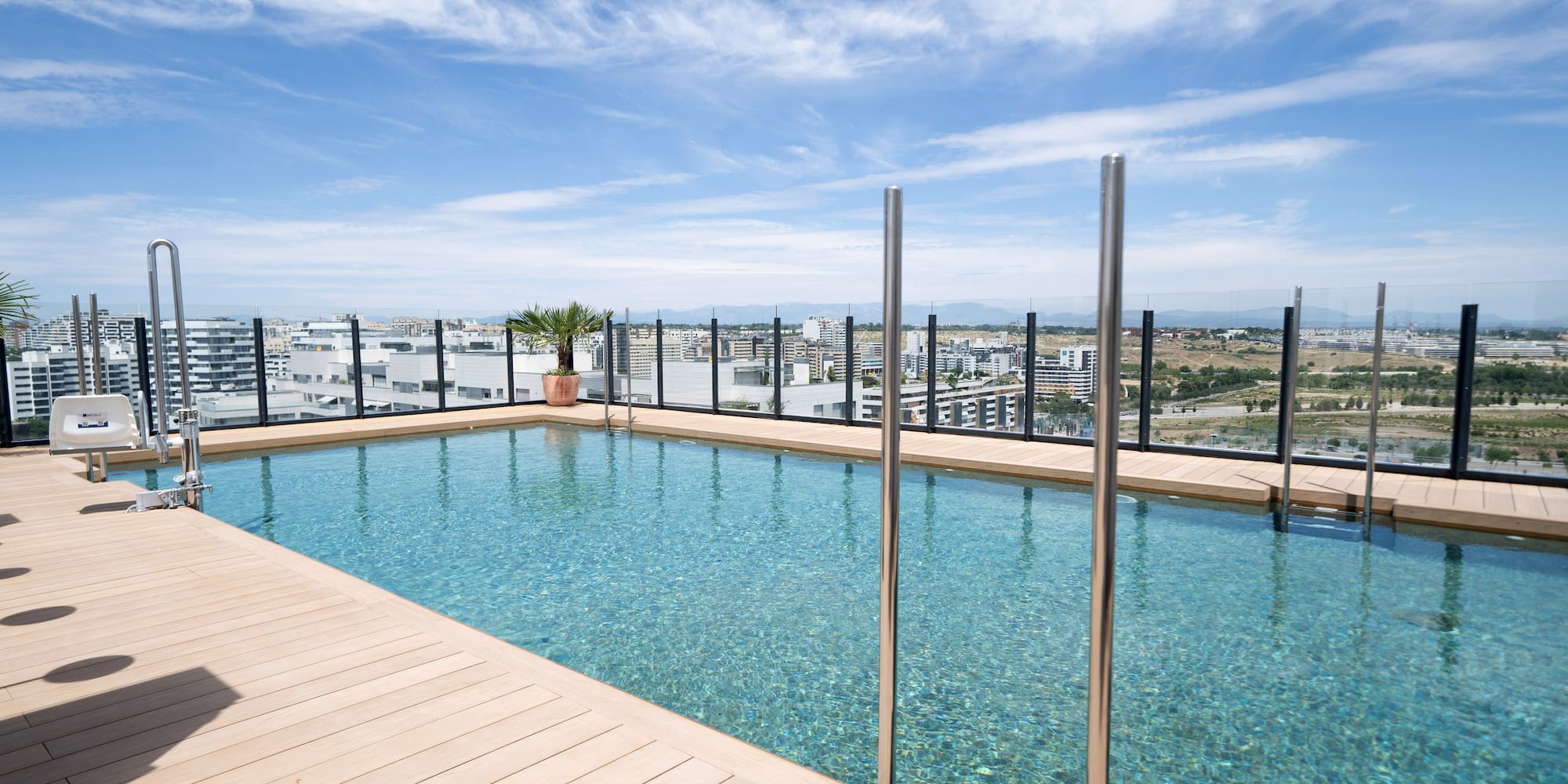 a pool with a wood deck and a wood floor