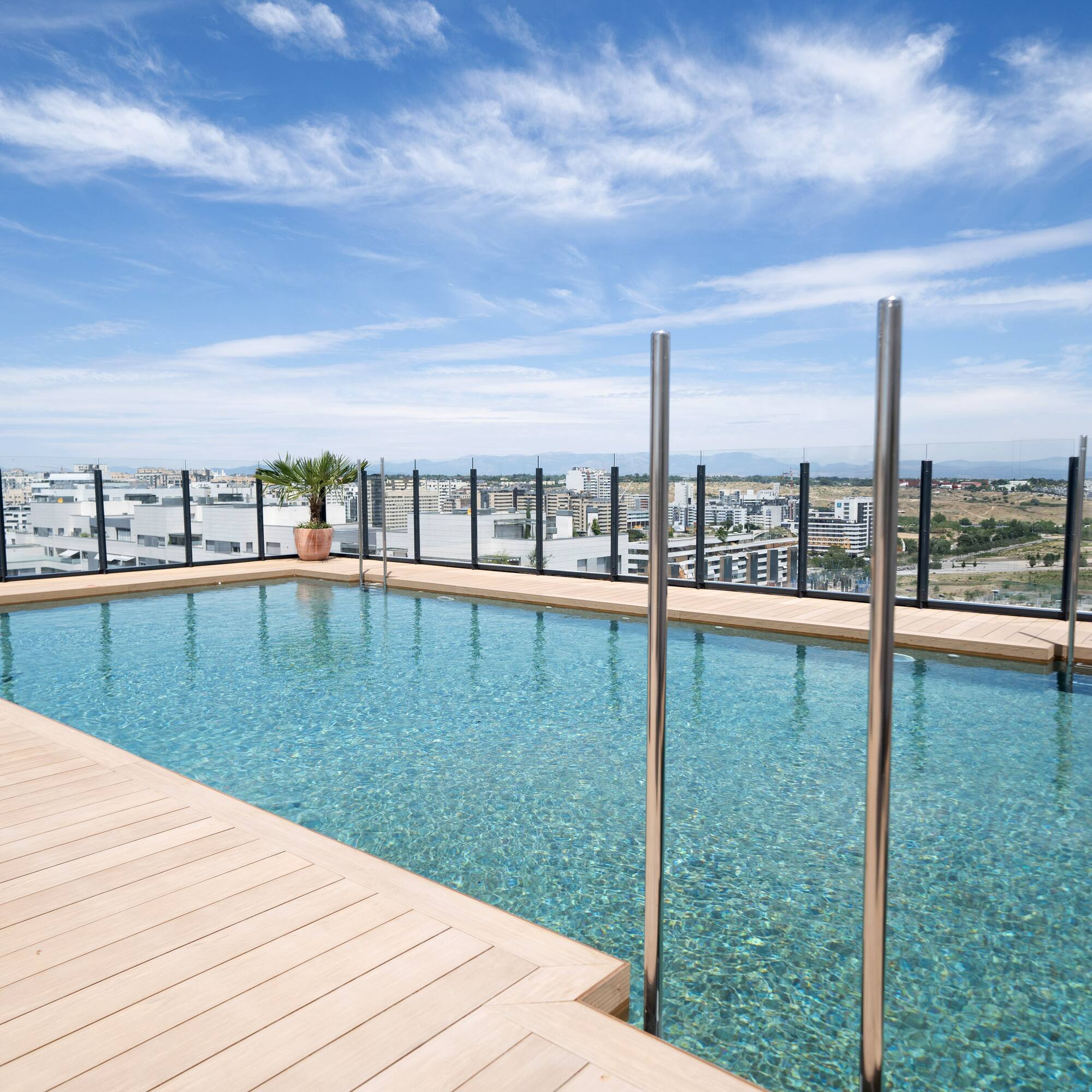 a pool with a wood deck and a wood floor