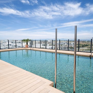 a pool with a wood deck and a wood floor