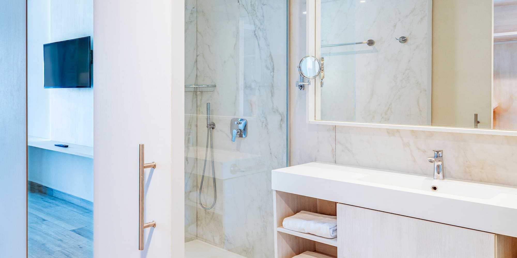 a bathroom with a shower and a mirror