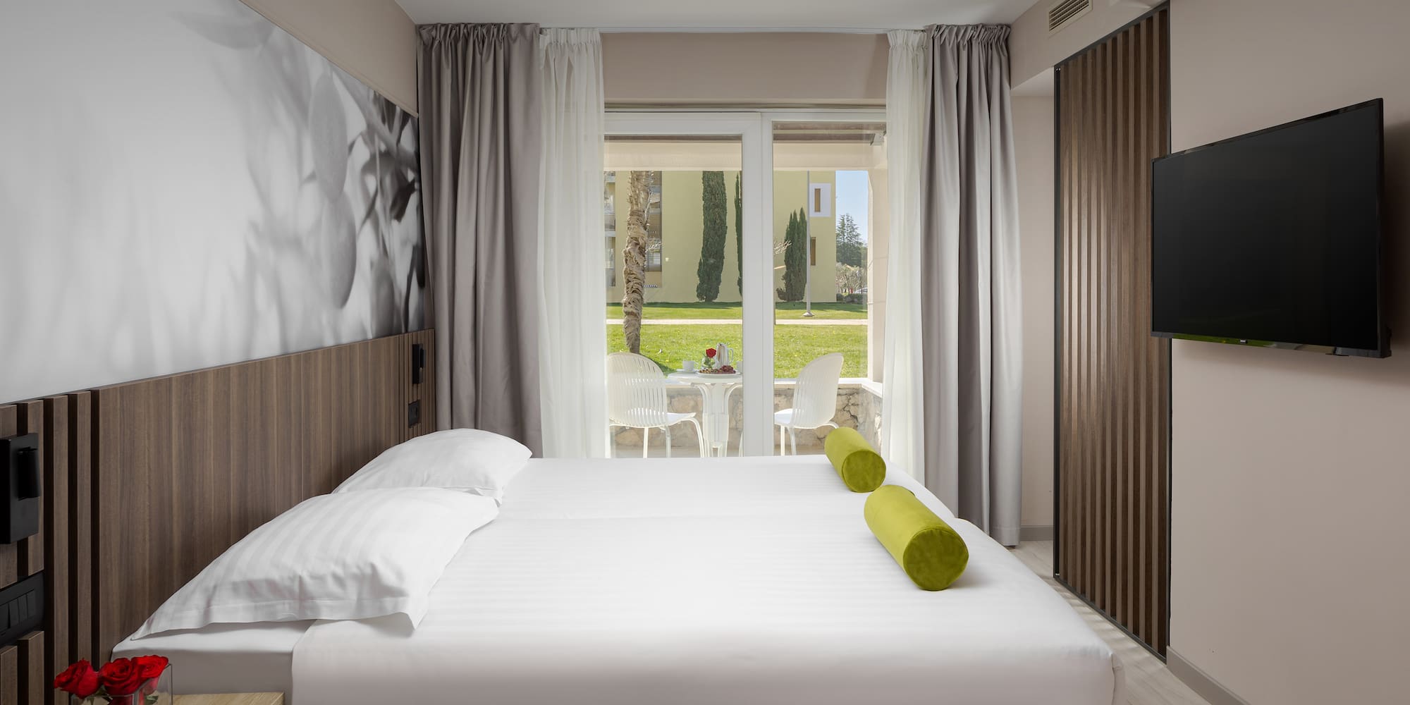 a bed with a television in a room