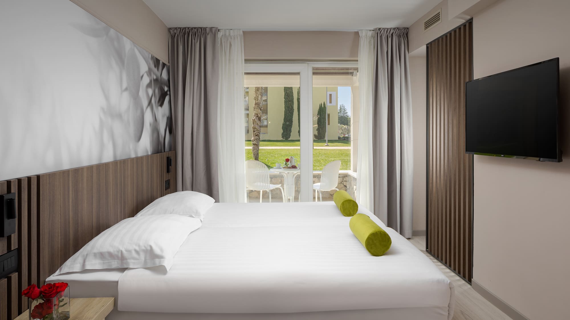 a bed with a television in a room