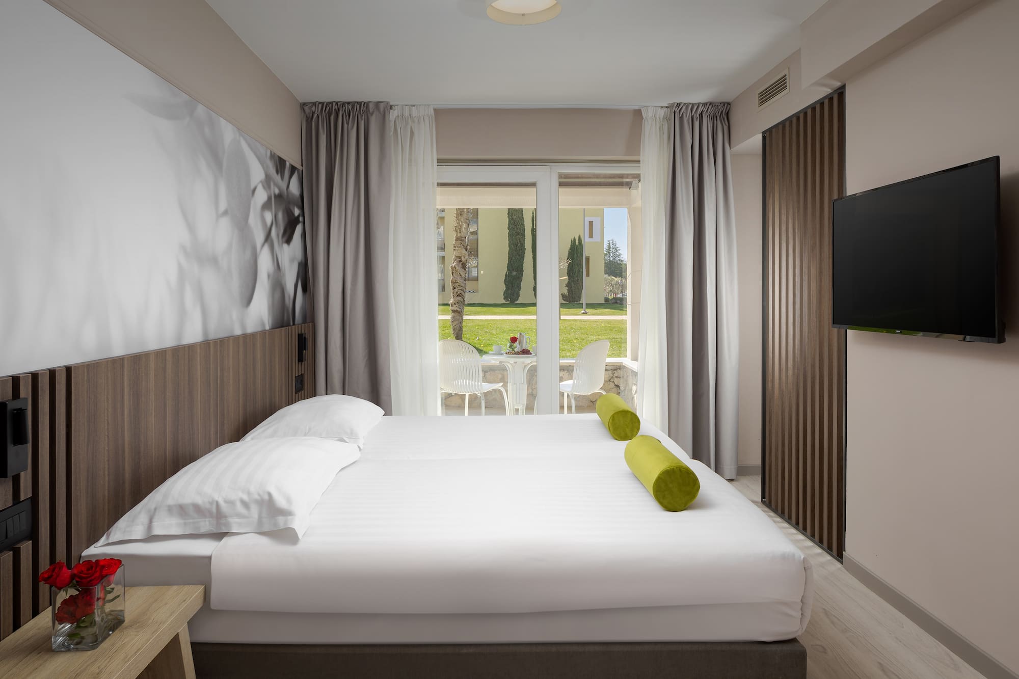 a bed with a television in a room