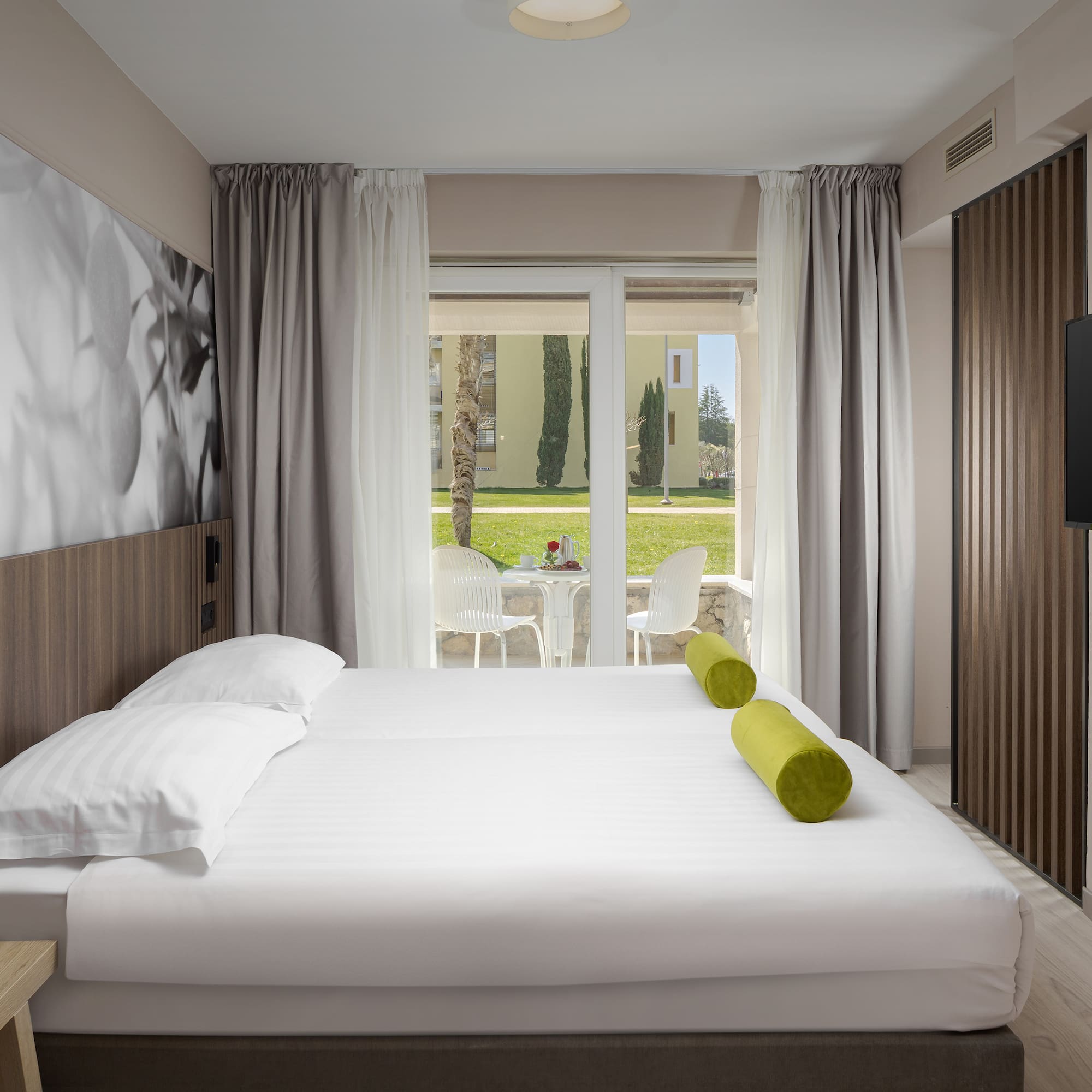 a bed with a television in a room