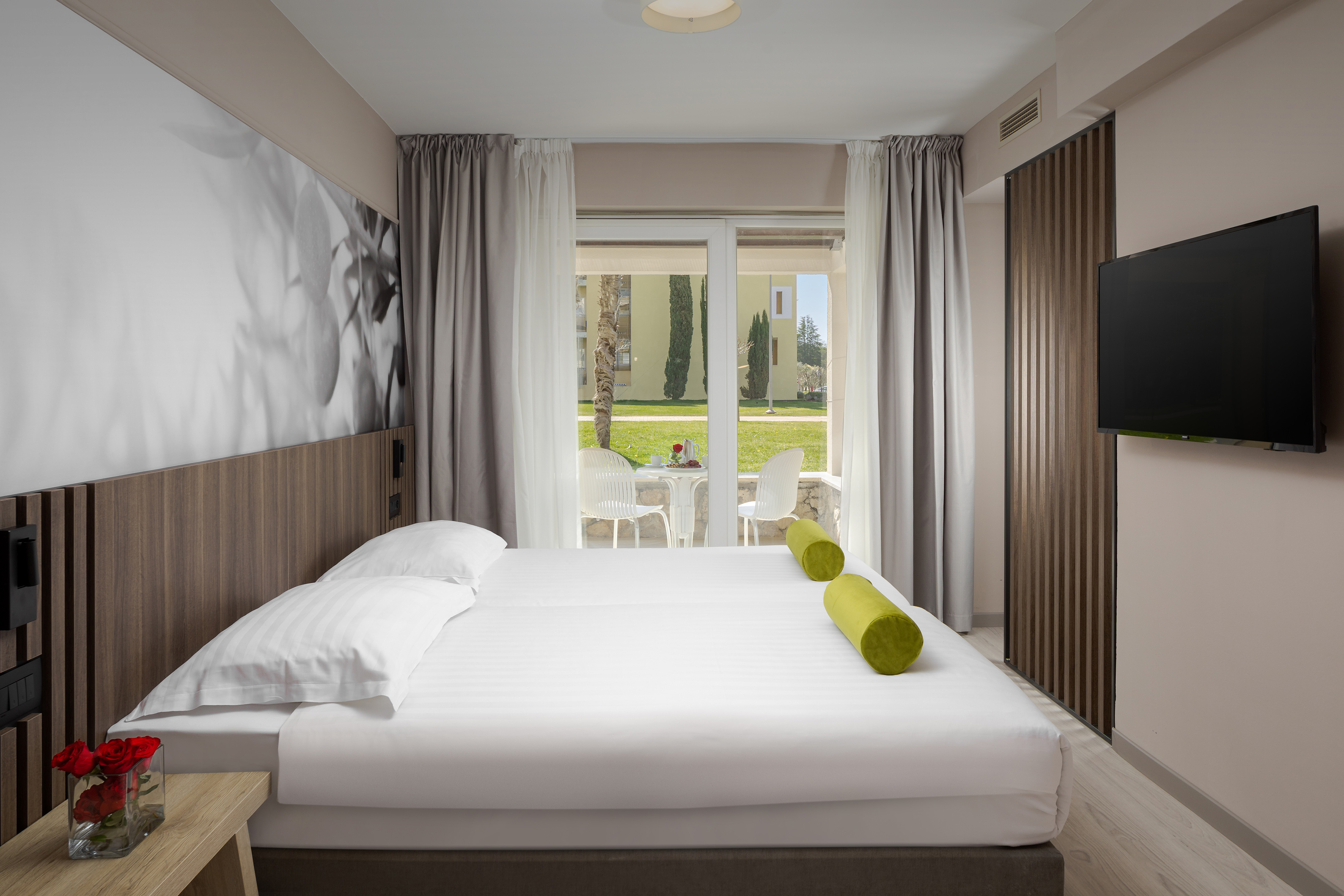 a bed with a television in a room