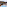Outdoor hot tub on a wooden deck terrace overlooking autumn mountains.